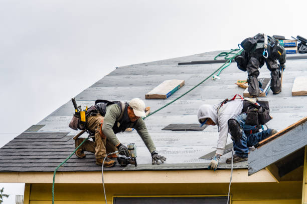 Professional Storm Damage Roof Repair technician working in Rutland, VT